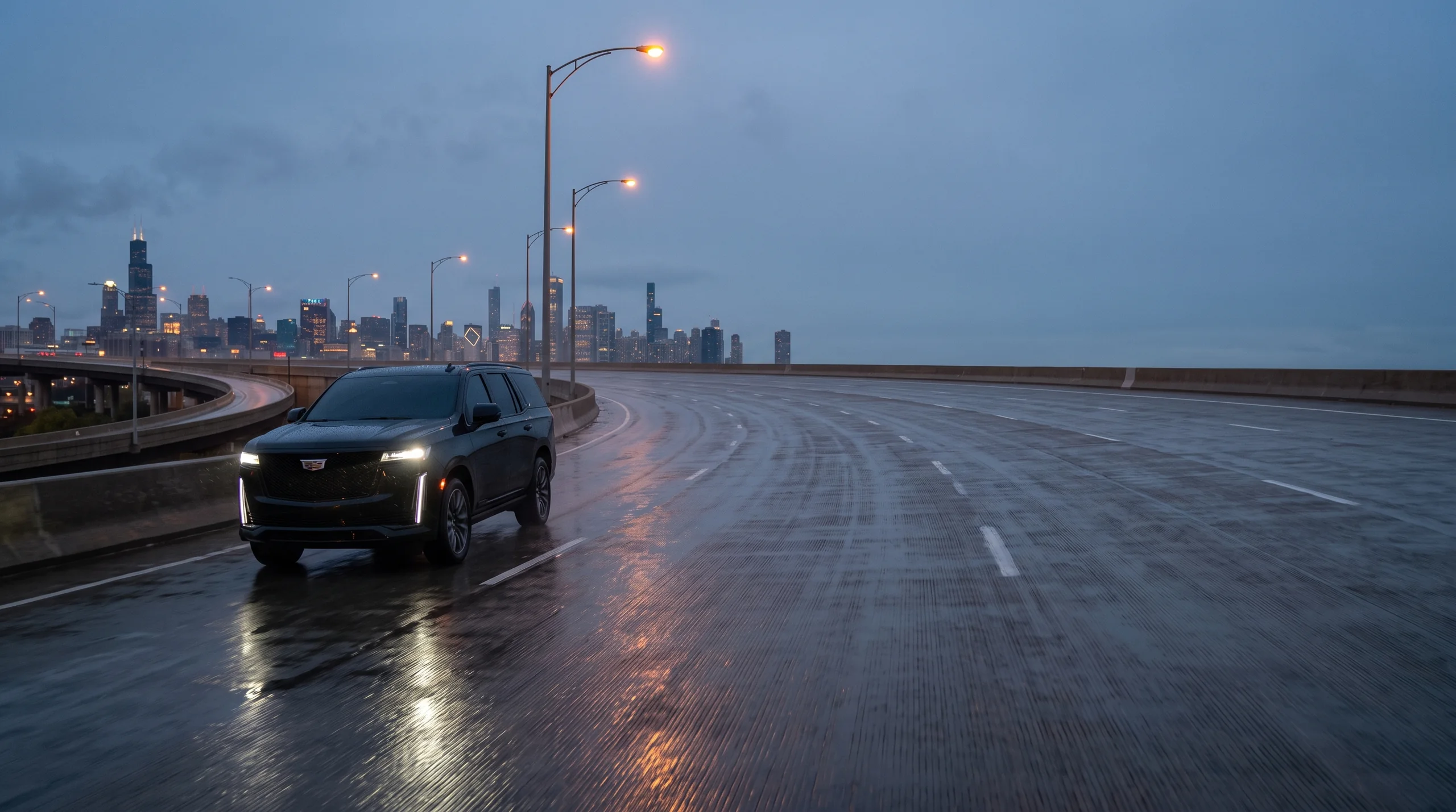 Black chauffeured SUV on a Chicago expressway with the skyline beyond