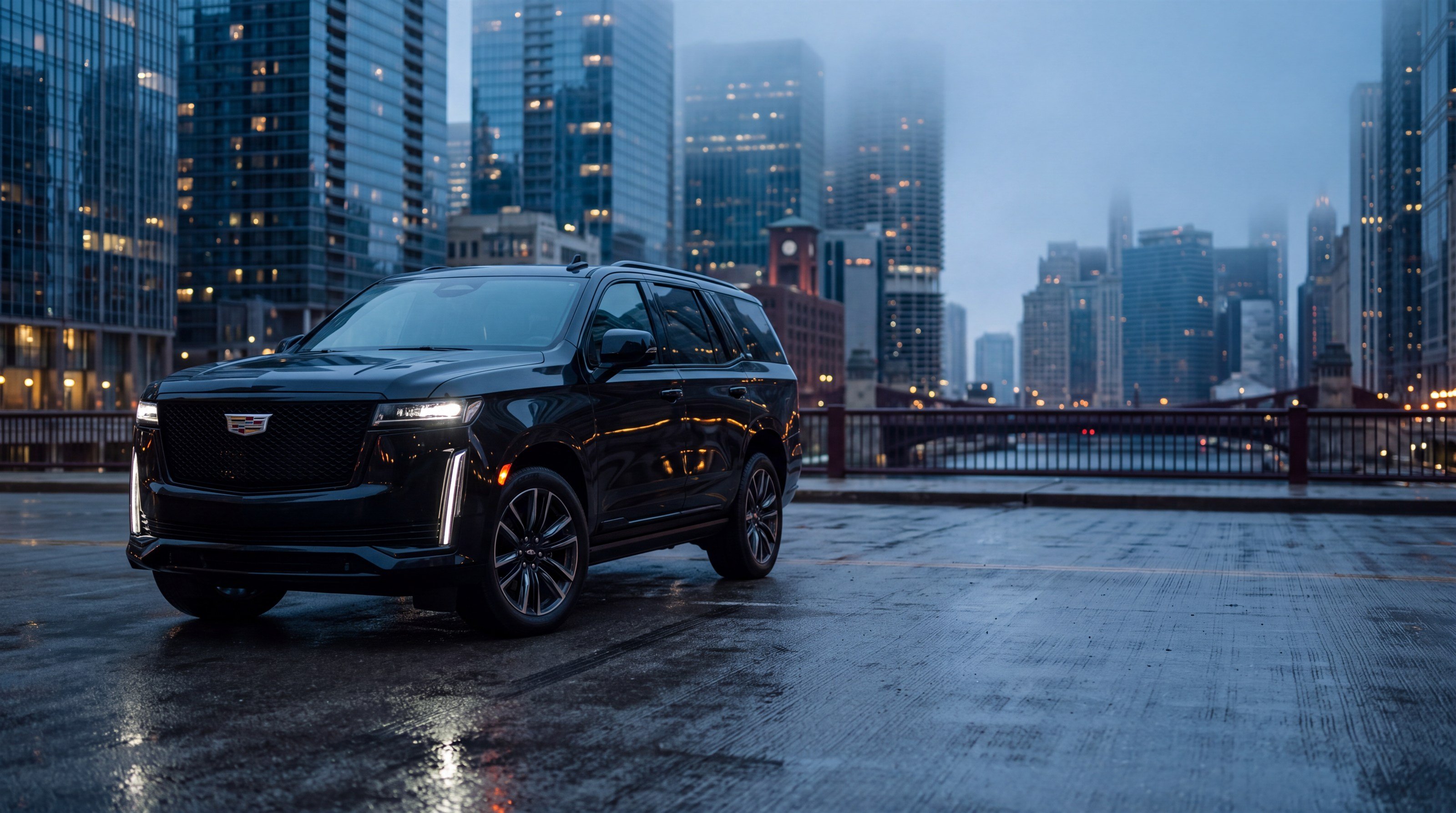 Black Cadillac Escalade chauffeur SUV on a Chicago bridge at dusk